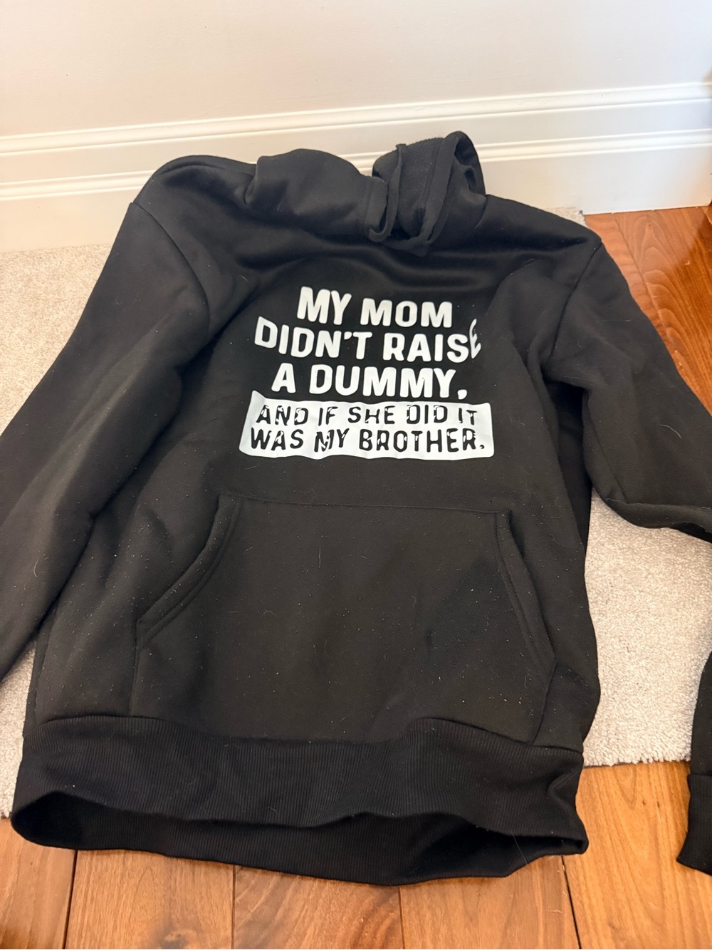 Black womens Hoodie with White Slogan - My Mom Didn't Raise a Dummy